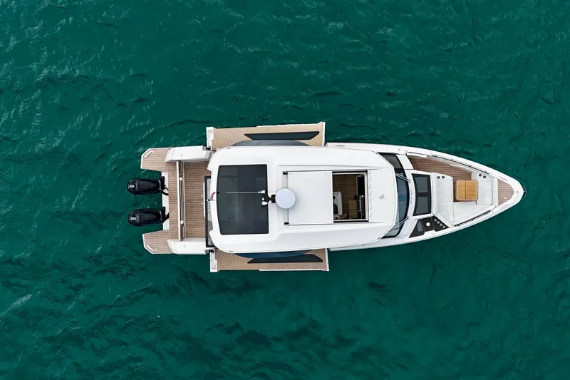 Slide: The Image of Top view of 2025 Saxdor 400 GTO yacht on turquoise water. - 6