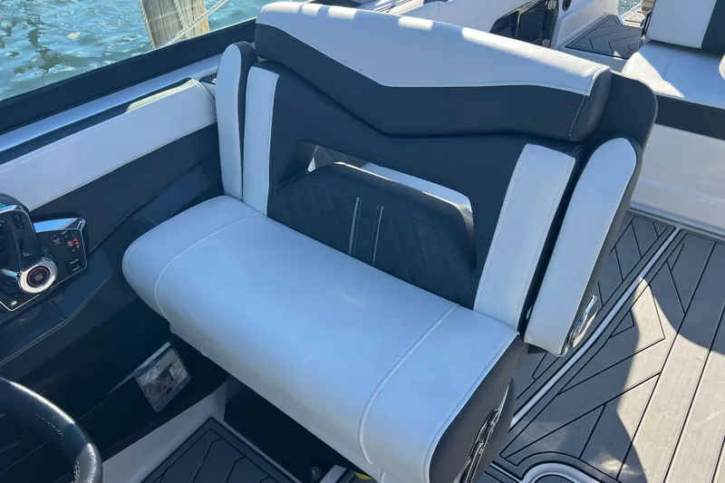 Slide: The Image of 2023 Monterey 275SS Super Sport boat seat with sleek black and white design. - 13