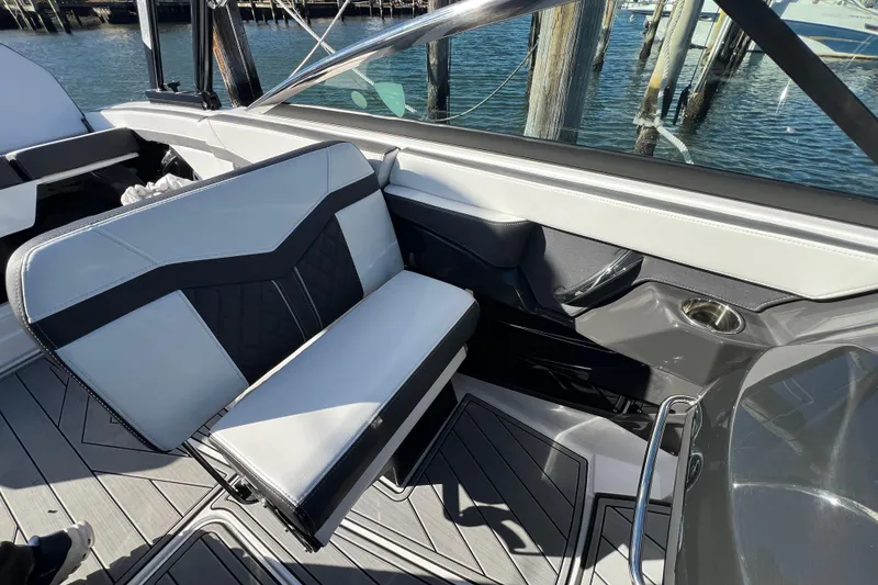 Slide: The Image of 2023 Monterey 275SS Super Sport boat interior with stylish seating and sleek design. - 14