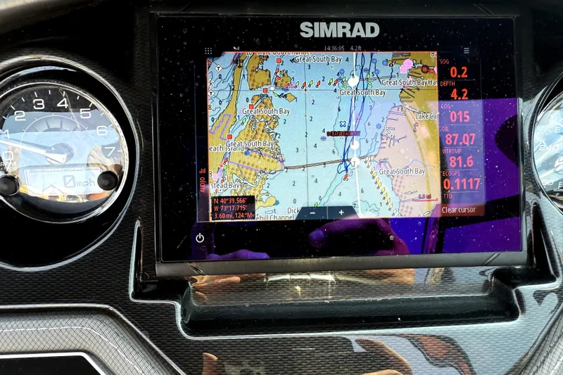 Slide: The Image of Dashboard of 2023 Monterey 275SS Super Sport with Simrad navigation display. - 17