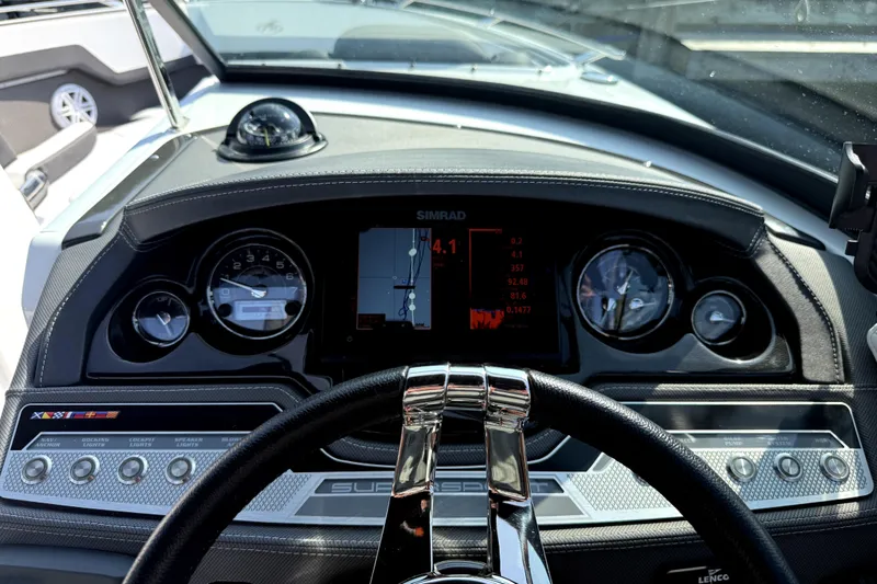 Slide: The Image of Dashboard of 2023 Monterey 275SS Super Sport boat with navigation and control instruments. - 18