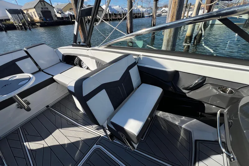 Slide: The Image of 2023 Monterey 275SS Super Sport boat interior with sleek seating and modern design. - 2
