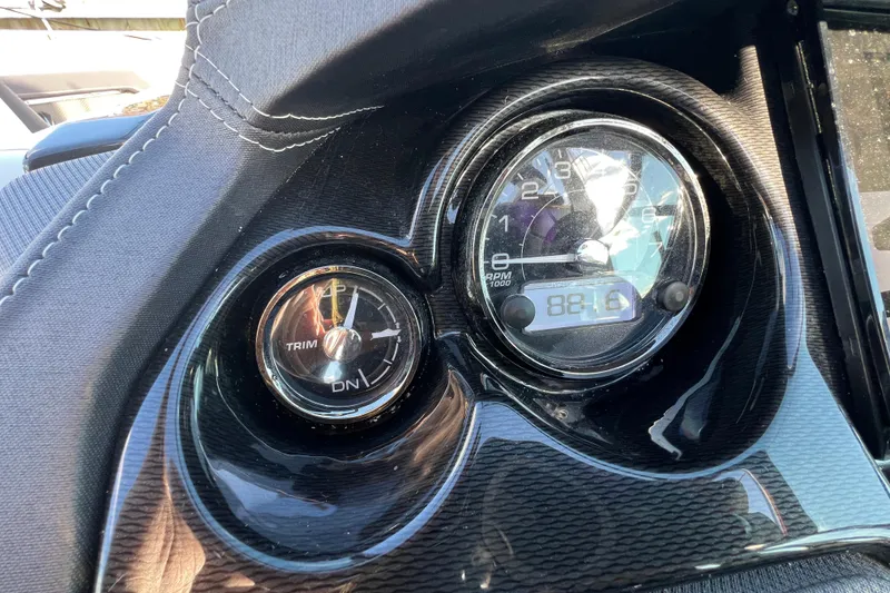 Slide: The Image of Dashboard of 2023 Monterey 275SS Super Sport boat with trim and RPM gauges. - 23