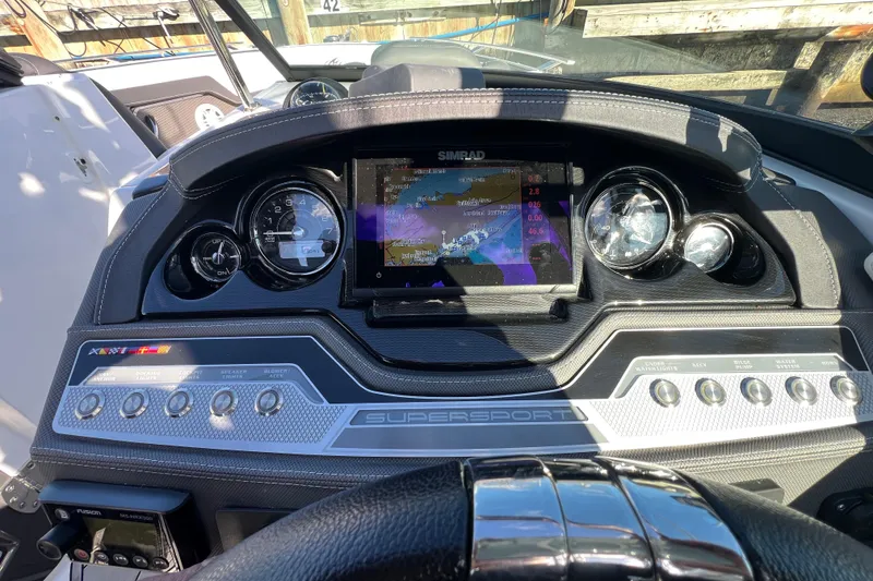 Slide: The Image of Dashboard of 2023 Monterey 275SS Super Sport boat with navigation display and controls. - 31