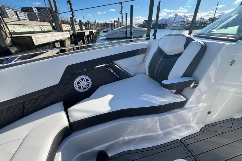 Slide: The Image of 2023 Monterey 275SS Super Sport boat interior with sleek seating and waterfront view. - 7