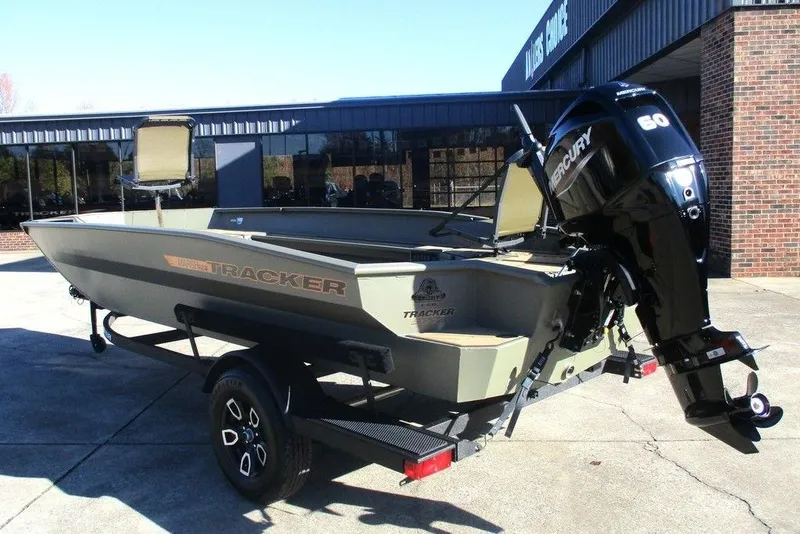 Slide: The Image of 2026 Tracker Grizzly 1756 T Marsh boat on trailer in outdoor setting. - 6