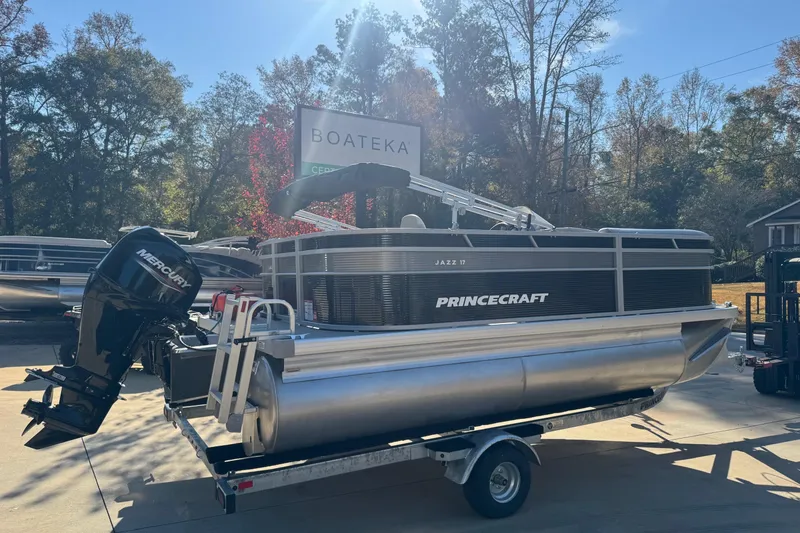 Slide: The Image of 2026 Princecraft Jazz 17 pontoon boat on trailer, displayed outdoors. - 3