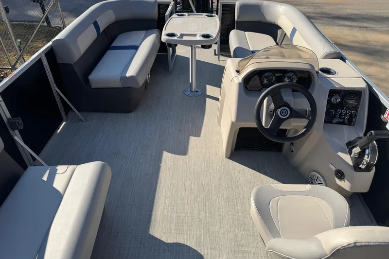 Slide: The Image of 2026 Princecraft Jazz 17 pontoon boat interior with seating and steering console. - 4