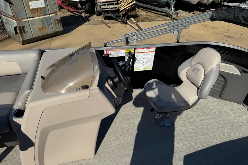 Slide: The Image of 2026 Princecraft Jazz 17 boat interior with steering console and captain's chair. - 5