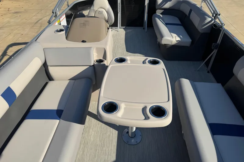 Slide: The Image of 2026 Princecraft Jazz 17 pontoon boat interior with seating and table. - 7