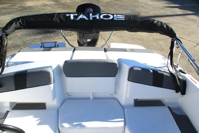 Slide: The Image of 2026 Tahoe T18 boat interior with cushioned seating and visible engine. - 4