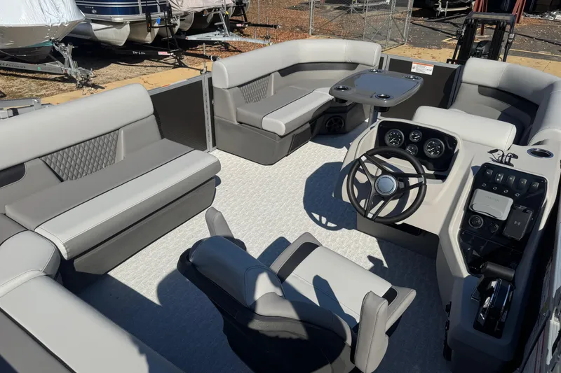 Slide: The Image of 2026 Princecraft Vectra 19 L pontoon boat interior with modern seating and steering console. - 3