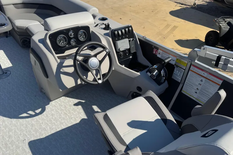 Slide: The Image of 2026 Princecraft Vectra 19 L boat interior with steering wheel and control panel. - 4