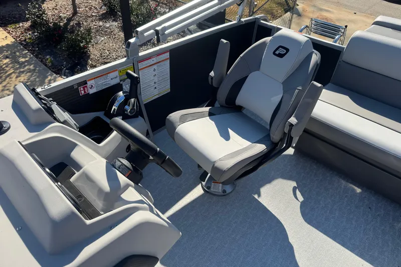Slide: The Image of 2026 Princecraft Vectra 19 L boat interior with steering console and captain's chair. - 5