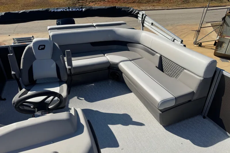 Slide: The Image of 2026 Princecraft Vectra 19 L pontoon boat interior with gray seating and steering console. - 6