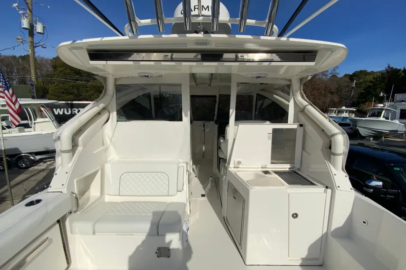 Slide: The Image of 2024 Pursuit DC 326 Dual Console interior flooring with textured surface and shoe. - 21