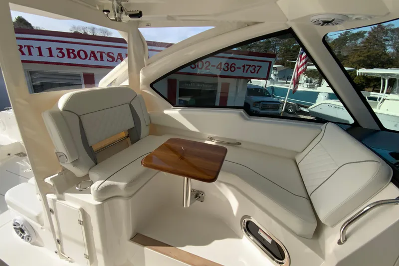 Slide: The Image of 2024 Pursuit DC 326 Dual Console dashboard with Garmin display showing trip data. - 26