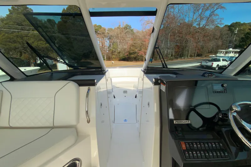 Slide: The Image of 2024 Pursuit DC 326 Dual Console boat with spacious seating and modern design. - 30