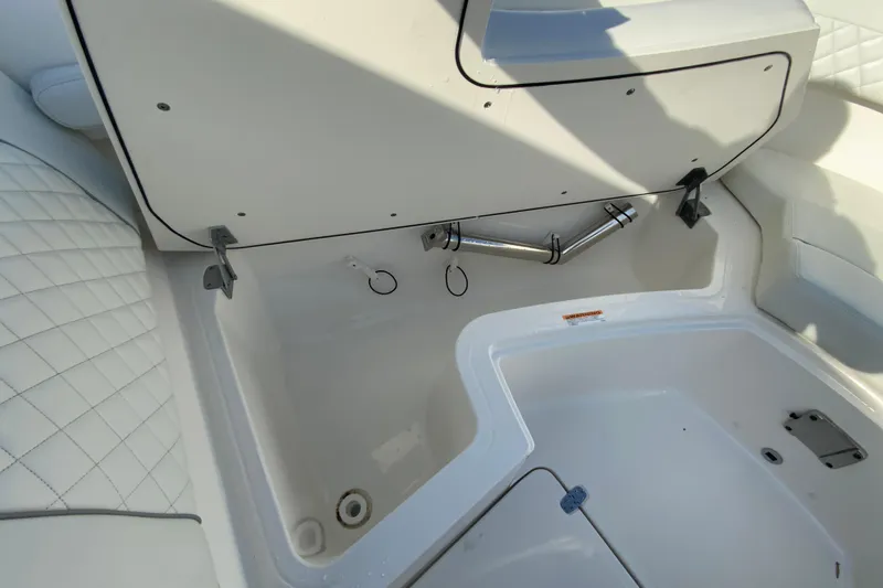 Slide: The Image of 2024 Pursuit DC 326 Dual Console boat bow view in a parking lot. - 32