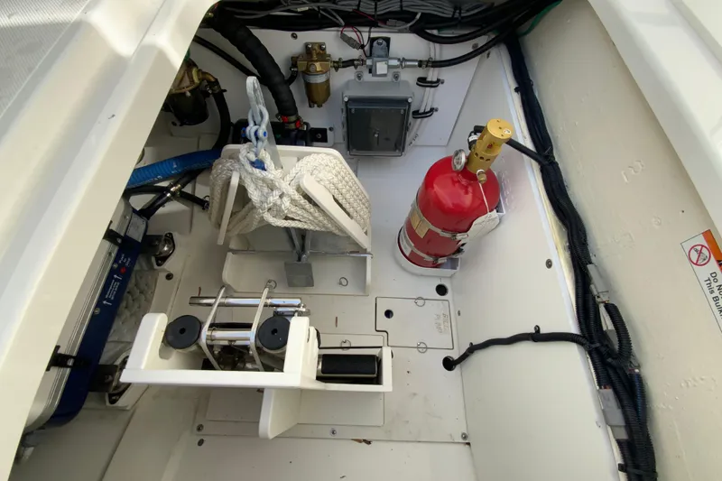 Slide: The Image of 2024 Pursuit DC 326 Dual Console engine compartment with Fischer Panda generator. - 48