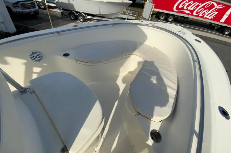 Slide: The Image of 2005 Pursuit 2570 Center Console boat with cushioned seating and speaker system. - 18