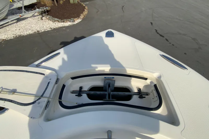Slide: The Image of Bow view of 2005 Pursuit 2570 Center Console with anchor compartment open. - 19