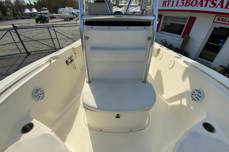 Slide: The Image of 2005 Pursuit 2570 Center Console boat interior with seating and speakers. - 20