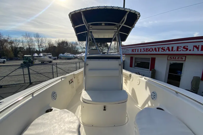 Slide: The Image of 2005 Pursuit 2570 Center Console boat at dealership, sunny day, outdoor display. - 21