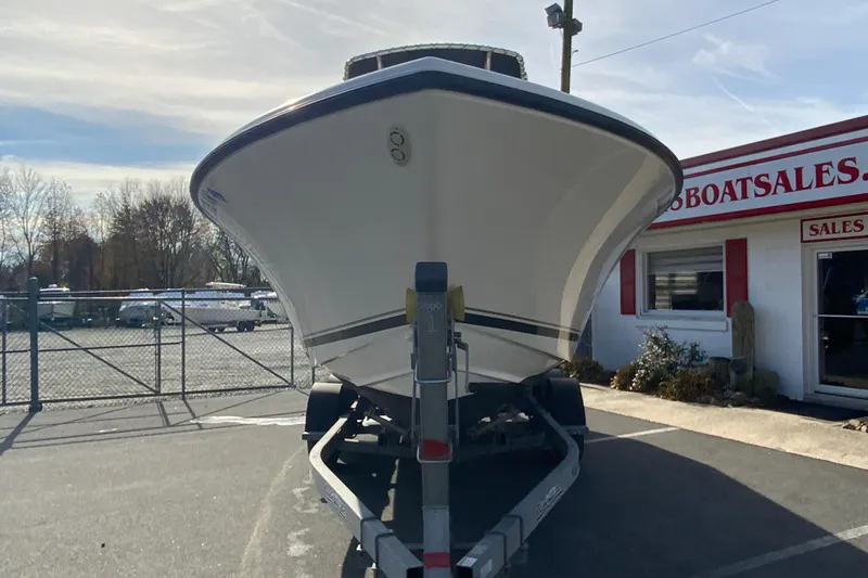 Slide: The Image of 2005 Pursuit 2570 Center Console boat on trailer at sales lot. - 4
