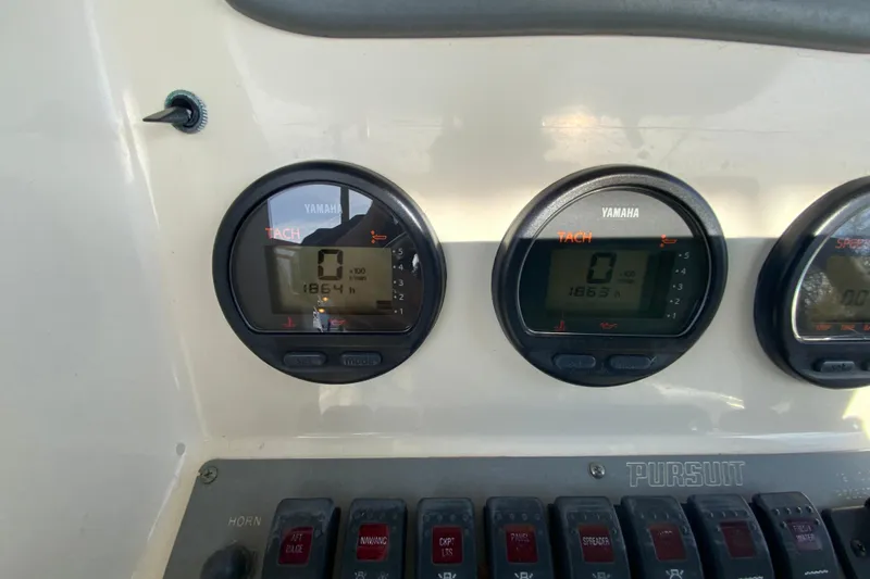 Slide: The Image of Dashboard of 2005 Pursuit 2570 Center Console with Yamaha tachometers. - 9