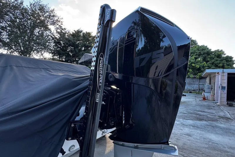 Slide: The Image of 2024 Vtech 18 outboard motor with Power-Pole, parked outdoors. - 14