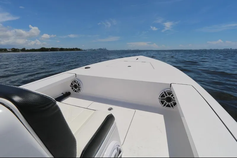 Slide: The Image of 2024 Vtech 18 boat on open water under clear blue sky. - 3