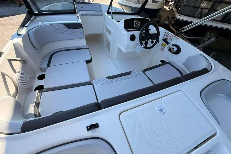Slide: The Image of 2026 Bayliner M17 boat interior with modern seating and steering console. - 5