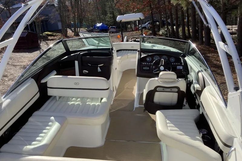Slide: The Image of 2014 Cobalt R5 boat interior with white leather seating and modern dashboard. - 13