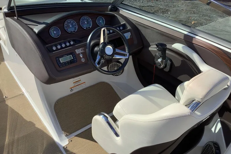 Slide: The Image of 2014 Cobalt R5 boat cockpit with steering wheel and control panel. - 17