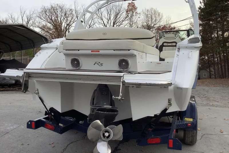 Slide: The Image of 2014 Cobalt R5 boat on trailer, rear view with propeller and seating. - 7