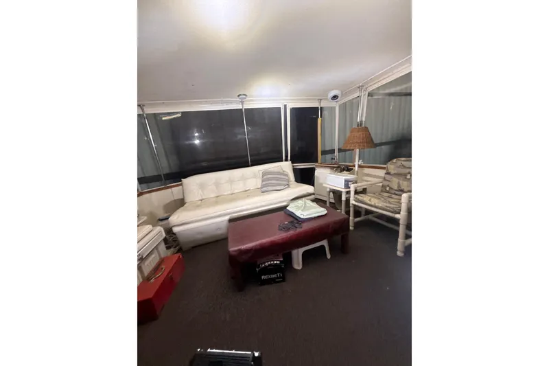 Slide: The Image of 1984 Viking 44 Motor Yacht interior with sofa, chairs, and table. - 110