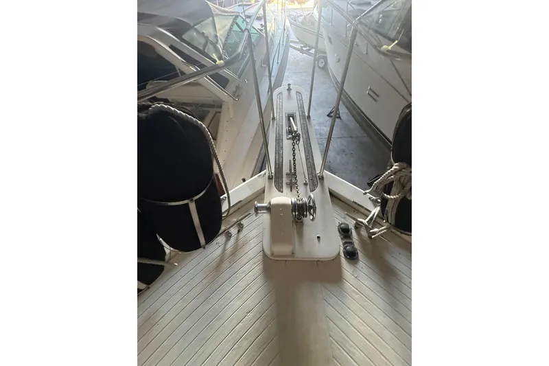 Slide: The Image of 1984 Viking 44 Motor Yacht deck with anchor chain and ropes in marina. - 119