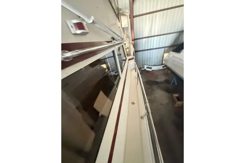 Slide: The Image of 1984 Viking 44 Motor Yacht side view in storage facility. - 121