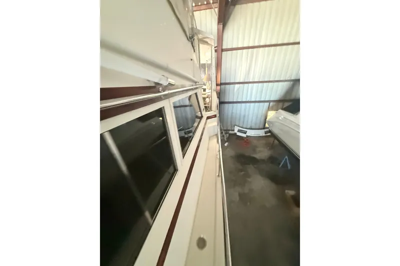 Slide: The Image of 1984 Viking 44 Motor Yacht side view in storage facility. - 122