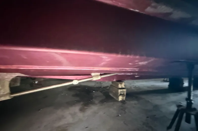 Slide: The Image of 1984 Viking 44 Motor Yacht hull under maintenance in a workshop. - 17