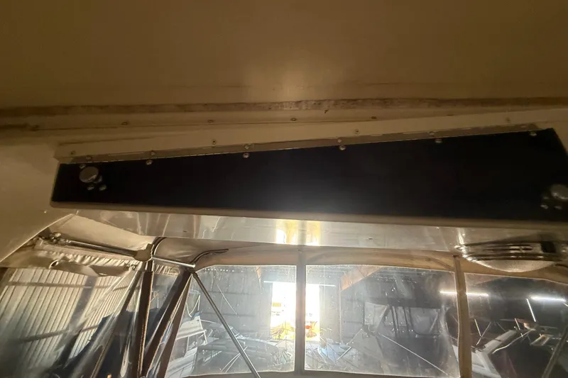 Slide: The Image of 1984 Viking 44 Motor Yacht interior view with window and ceiling details. - 42