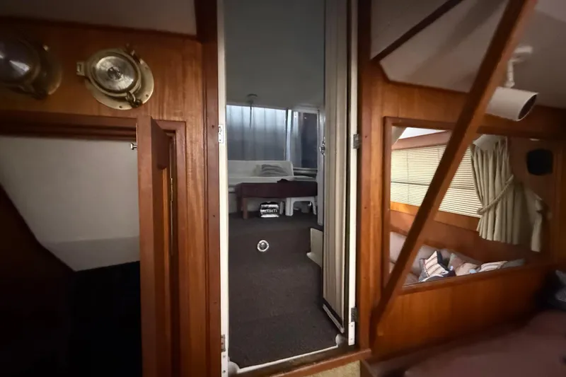 Slide: The Image of Interior of 1984 Viking 44 Motor Yacht with wood paneling and cozy cabin spaces. - 48