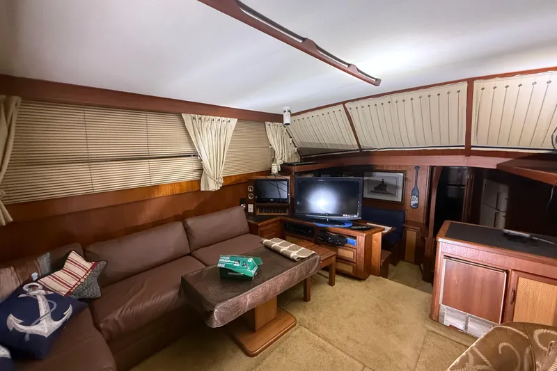 Slide: The Image of Interior of 1984 Viking 44 Motor Yacht with cozy seating and entertainment area. - 49
