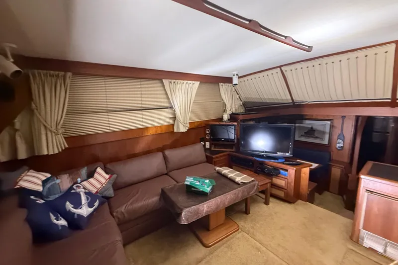 Slide: The Image of Interior of 1984 Viking 44 Motor Yacht with cozy seating and entertainment area. - 50