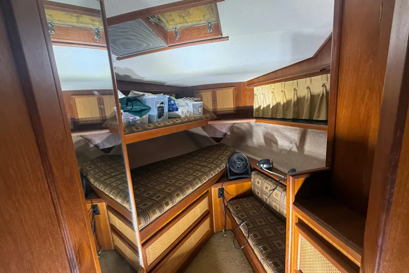 Slide: The Image of 1984 Viking 44 Motor Yacht cabin with wood interior and patterned cushions. - 62
