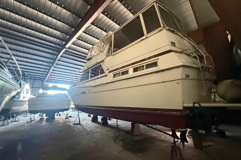 Slide: The Image of 1984 Viking 44 Motor Yacht stored in a spacious indoor facility. - 7