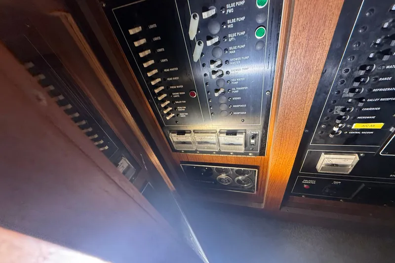 Slide: The Image of Electrical control panel on a 1984 Viking 44 Motor Yacht, featuring switches and indicators. - 74