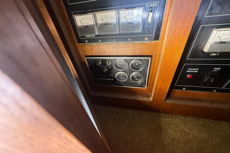 Slide: The Image of Control panel of a 1984 Viking 44 Motor Yacht with gauges and switches. - 75