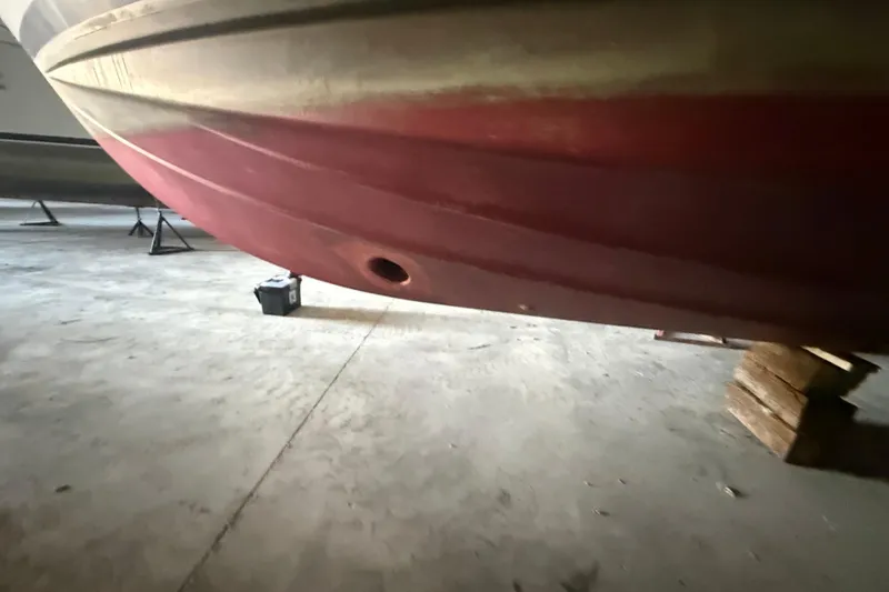 Slide: The Image of 1984 Viking 44 Motor Yacht hull in storage, supported by blocks. - 8